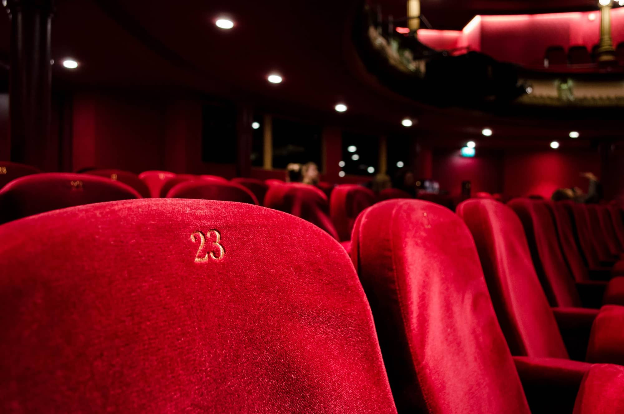Close up image of red theatre chair. Image is used for web design only.